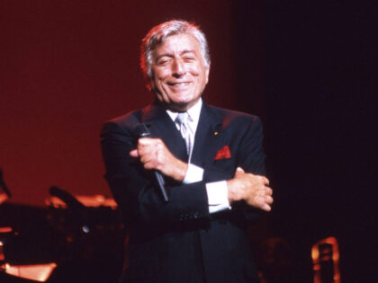 Tony Bennett performs on stage with The Count Basie Orchestra, Radio City Music Hall, New York, United States, 1998. (Photo by Martyn Goodacre/Getty Images)