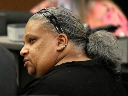 Rafaela Vasquez speaks with her attorney during a court hearing prior to accepting a plea