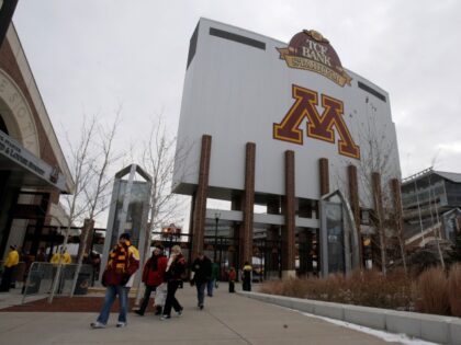 FILE - In this Nov. 24, 2012 file photo, Minnesota fans walk outside TCF Bank Stadium before an NCAA college football game in Minneapolis. The University of Minnesota lost almost $16,000 last year on alcohol sales at home football games, despite selling more than $900,000 worth of beer and wine. …