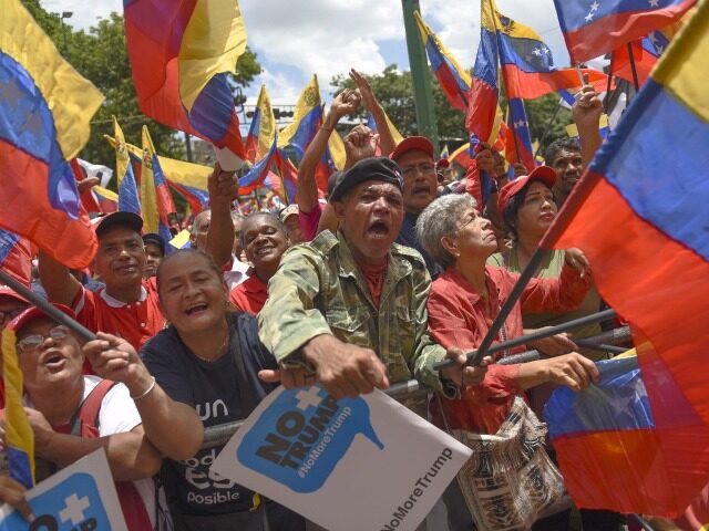 CARACAS, VENEZUELA - AUGUST 10: Pro-government supporters wave Venezuelan flags during a d
