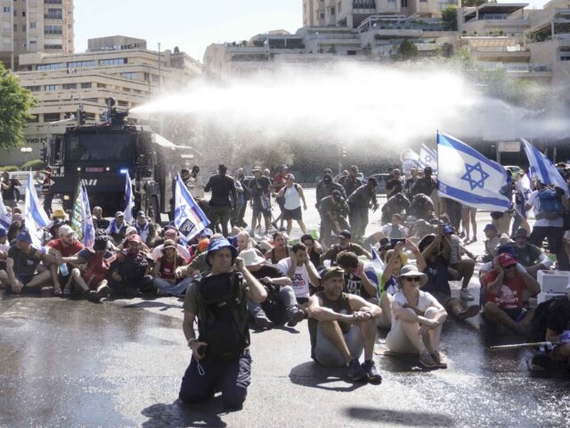 Water cannon Israel protest (Mahmoud Illean / Associated Press)