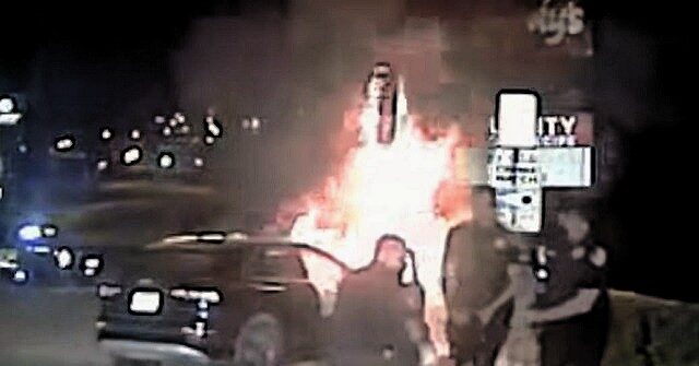 WATCH: Texas Cops Rescue Unconscious Man from Burning Car
