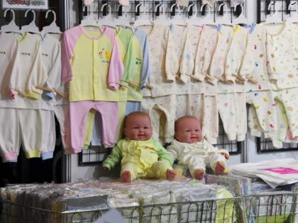 his picture taken on December 21, 2017 shows baby clothes displayed on a booth at a baby f