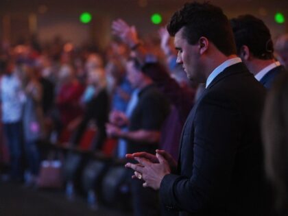 PHOENIX, AZ - OCTOBER 5 : Turning Point USA founder Charlie Kirk prays as he attends Freedom Night In America at Dream City Church on October 5, 2022 in Phoenix, Arizona. Kirk spoke about abortions and border issues as he addressed serval hundred people in attendance.(Photo by Joshua Lott/The Washington …