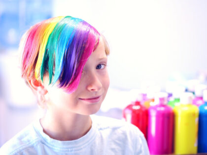 Child with transgender- and rainbow-colored hair