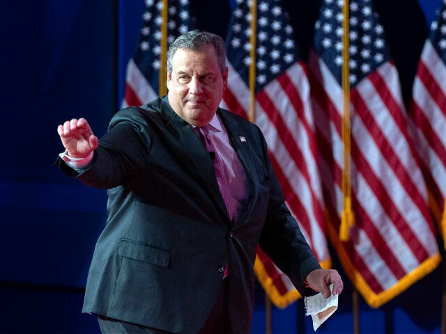 Republican presidential candidate former New Jersey Gov. Chris Christie waves to the audie