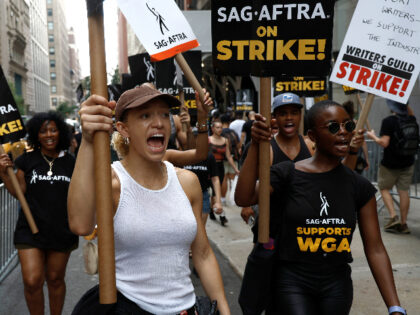 NEW YORK, NEW YORK - JULY 18: SAG-AFTRA members and supporters protest as the SAG-AFTRA Actors Union Strike continues on Day 6 in front of Netflix on July 18, 2023 in New York City. Members of SAG-AFTRA, Hollywood's largest union which represents actors and other media professionals, have joined striking …