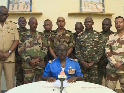 This video frame grab image obtained by AFP from ORTN - Télé Sahel on July 26, 2023 shows Colonel Major Amadou Abdramane (C), spokesperson for the National Committee for the Salvation of the People (CNSP) speaking during a televised statement. Soldiers claimed on July 26, 2023 to have overthrown the …