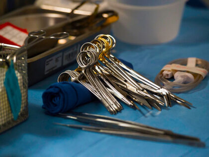Surgical instruments and supplies lay on a table during a kidney transplant surgery at Med