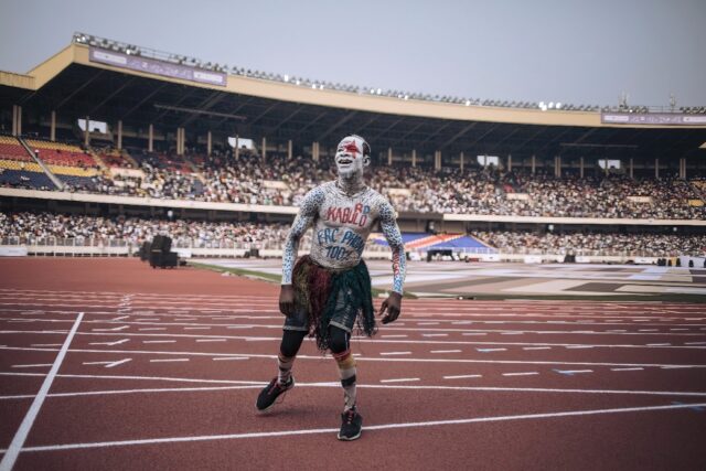 Some 80,000 spectators packed Kinshasa's Stade des Martyrs stadium to watch a flag parade