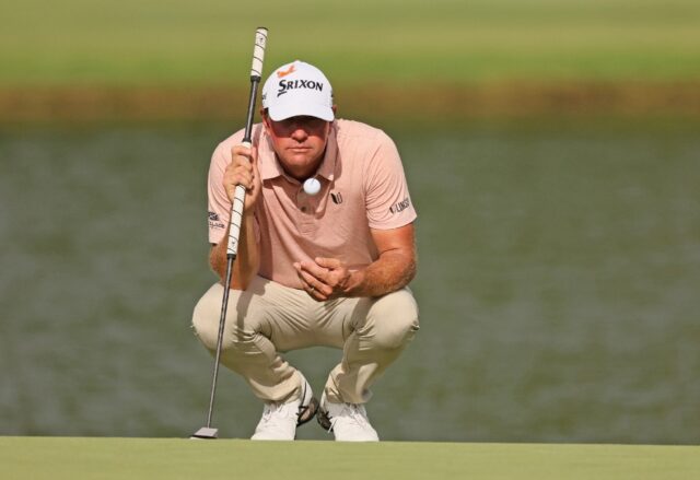 American Lucas Glover lines up a putt on the way to the first round lead at the US PGA Bar