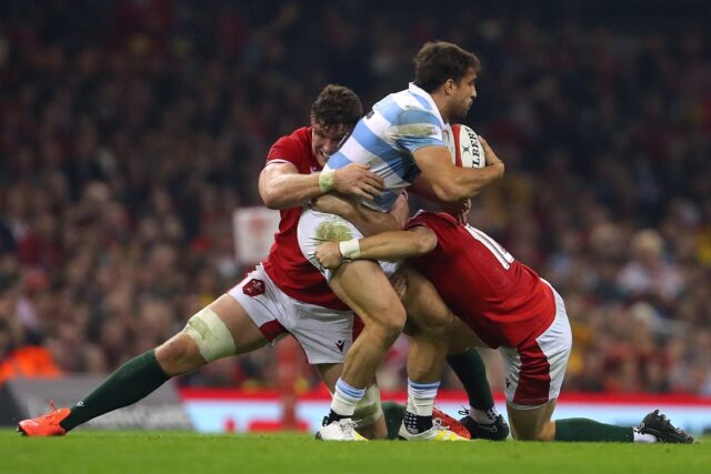 Argentina full-back Juan Cruz Mallia (C) is tackled during a 2022 Test in Wales