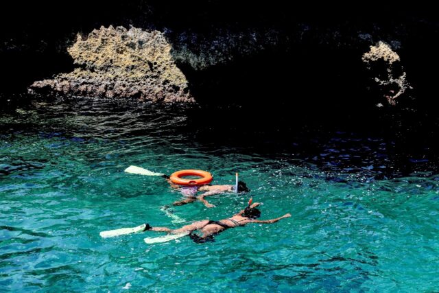 Bathers in the Mediterranean off the village of Kfarabida in north Lebanon