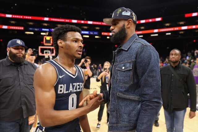 Bronny James and his NBA star father LeBron James talk after a Sierra Canyon school basket