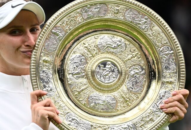 Champion: Marketa Vondrousova celebrates as she kisses the Venus Rosewater Dish trophy