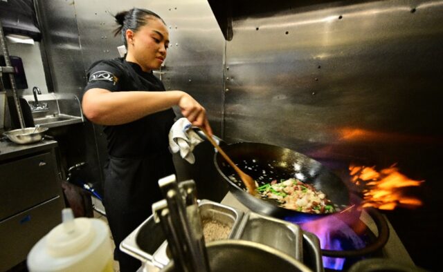 Chef Tue Nguyen cooks her Didi Fried Rice in the kitchen of her first restaurant Di Di in