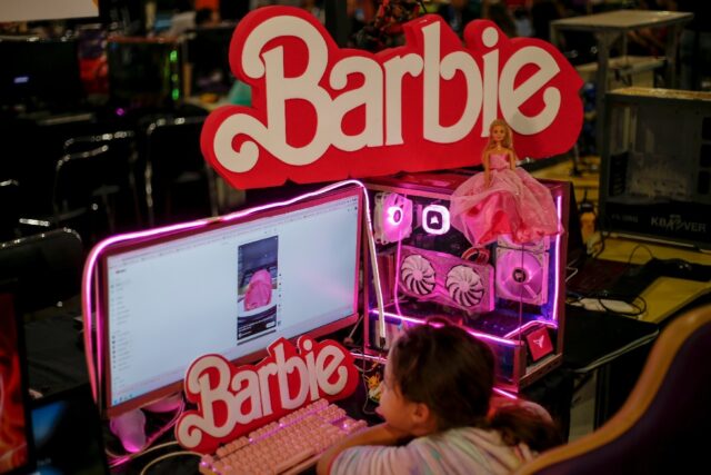 A child looks at a Barbie-themed computer in Anhembi, northern Sao Paulo, Brazil, on July