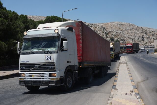 A convoy carrying humanitarian aid arrives in Syria after crossing the Bab al-Hawa border