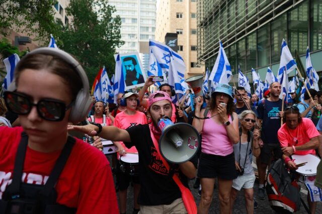 Demonstrators in front of the Tel Aviv stock exchange in a 'day of resistance' against the