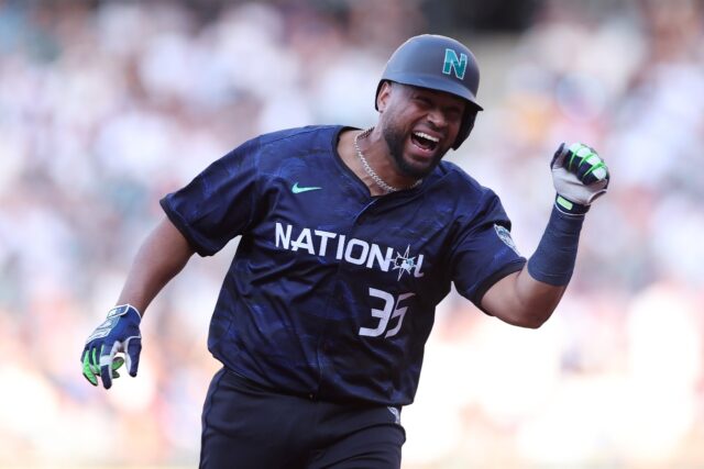 Elias Díaz of the Colorado Rockies celebrates after hitting a home run in the eighth inni