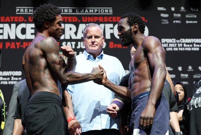 Errol Spence and Terence Crawford shake hands at their weigh-in for their welterweight wor