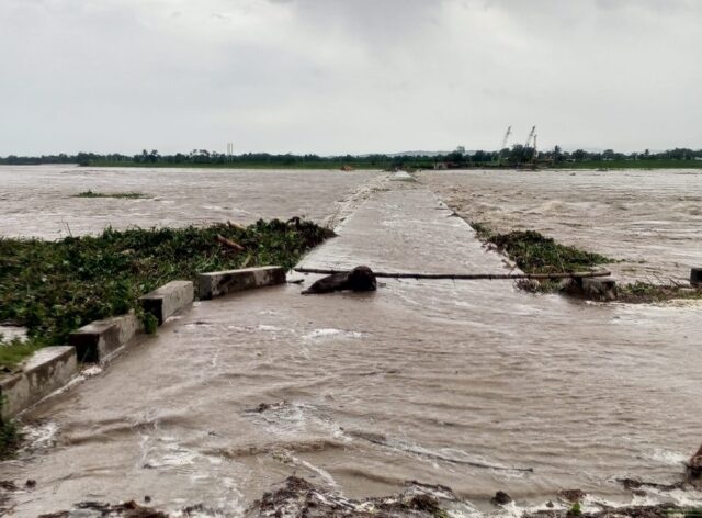 A flooded bridge is seen in Cagayan province, Philippines, after a river overflowed due to