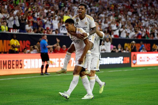Jude Bellingham (left) is celebrates with team-mate Rodrigo after opening the scoring for
