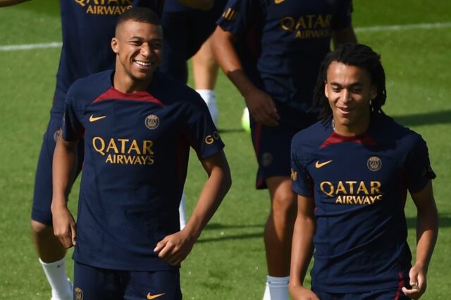 Kylian Mbappe (left) and his younger brother Ethan at PSG training ahead of the club's Ja