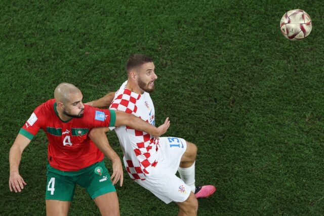 Morocco star Sofyan Amrabat (L) fights for possession against Croatia during the 2022 Worl