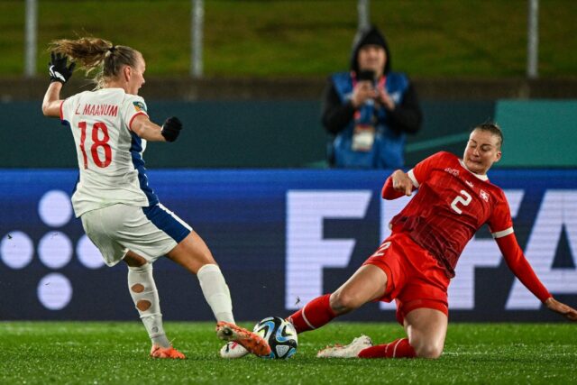 Norway's Frida Maanum (L) and Switzerland's Julia Stierli fight for the ball during their