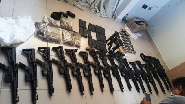 A picture released by the Bolivian Ministry of Government shows weaponry and drugs seized