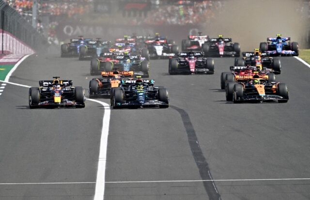Pole-sitter Lewis Hamilton (centre) getting swamped at the start