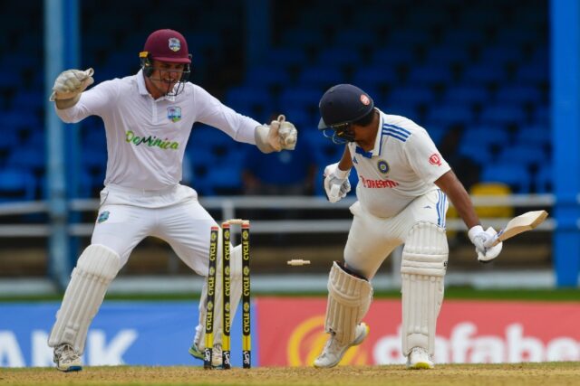 Rohit Sharma (R) is bowled as West Indies wicketkeeper Joshua Da Silva celebrates