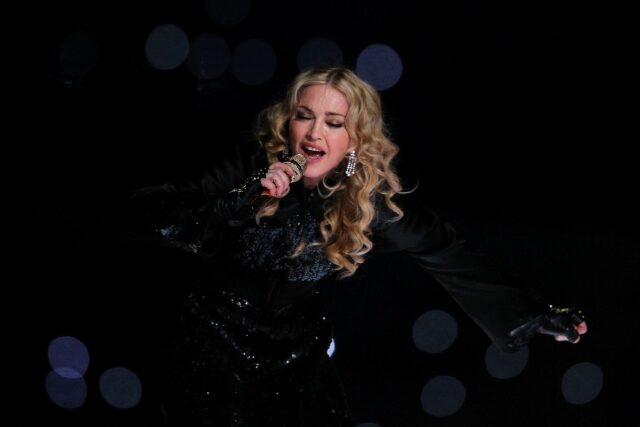 Singer Madonna performs during the Bridgestone Super Bowl XLVI Halftime Show at Lucas Oil