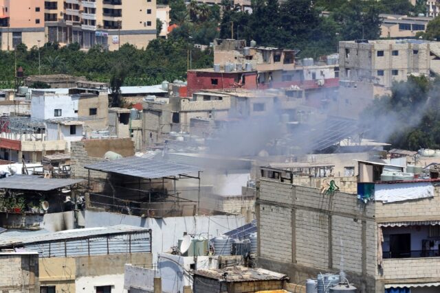 Smoke billows during inside Ain al-Helweh Palestinian refugee camp in the Lebanese coastal