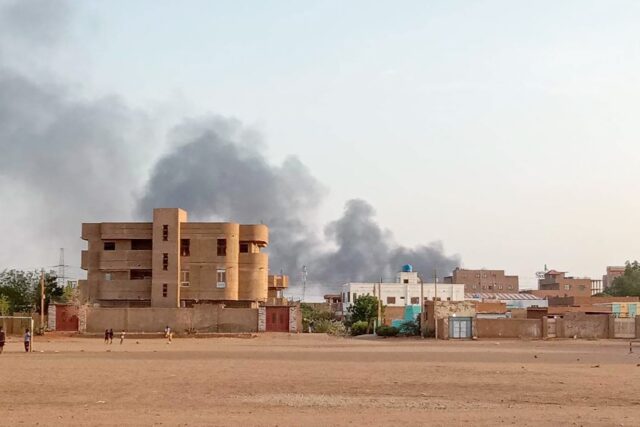 Smoke billows in the distance around the Khartoum North district amid ongoing fighting