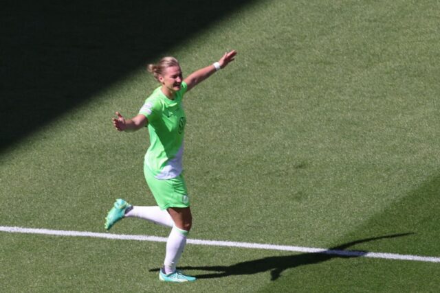 Wolfsburg and Germany forward Alexandra Popp celebrates scoring in the Champions League fi
