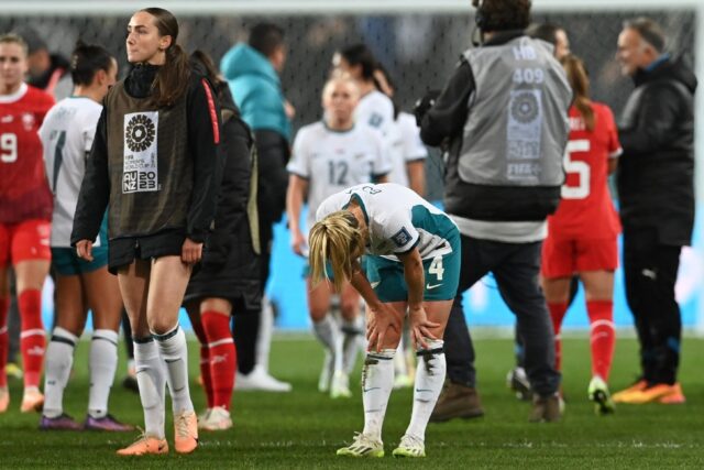 New Zealand midfielder Katie Bowen (C) shows her disappointment as the co-hosts exited the