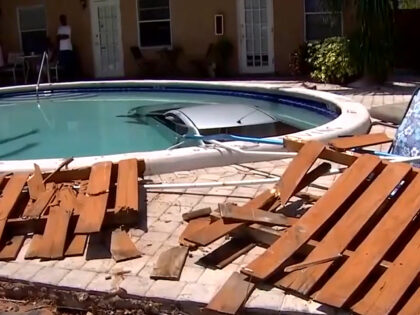 A Florida woman reportedly drove her silver sedan through a fence and into an in-ground pool at a Fort Lauderdale apartment complex on the Fourth of July.