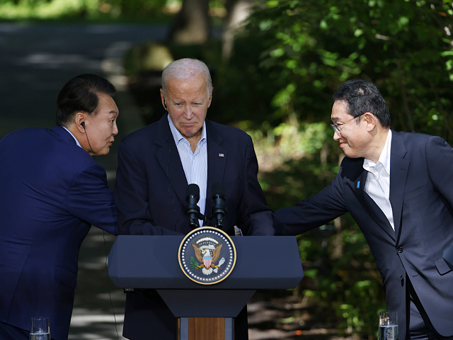 Fumio Kishida, Japan's prime minister, from right, US President Joe Biden and Yoon Suk Yeol, president of South Korea, at a news conference during a trilateral summit at Camp David, Maryland, US, on Friday, Aug. 18, 2023. Biden is looking for a way to weave the US trilateral relationship with allies Japan and South Korea so tightly together it wont unravel as it has done in the past. Photographer: Ting Shen/Bloomberg via Getty Images