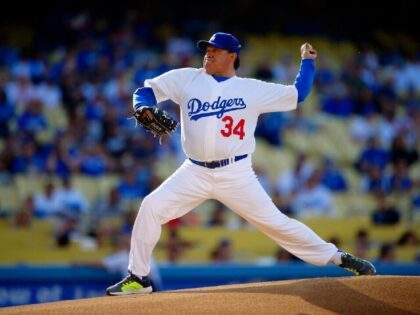 Fernando Valenzuela throws to the plate during the Old-Timers baseball game, Saturday, Jun