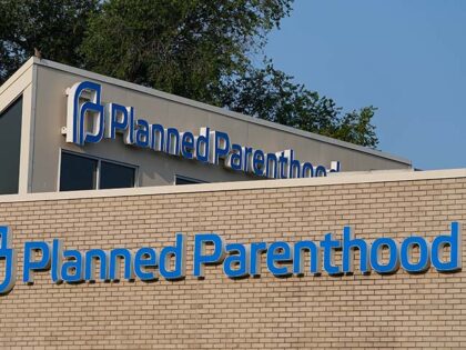 A Planned Parenthood sign is displayed on the outside of a clinic during a news conference