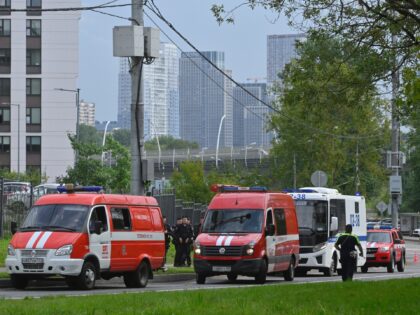 Police and emergency vehicles parked at the side of the wreckage of the drone fell near the Karamyshevskaya embankment to the after a reported drone attack in Moscow, Russia, on Friday, Aug. 11, 2023. The Mayor of Moscow, Sergei Sobyanin said a drone fell in western Moscow after it was …