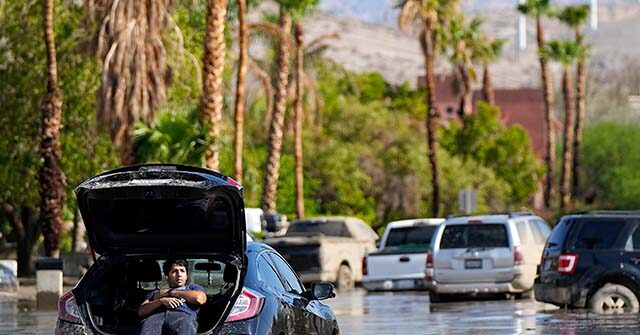 NextImg:Flooding in Palm Springs as Hilary Passes Through: Trapped Cars, Roads Washed Away