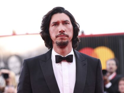 Adam Driver poses for photographers upon arrival for the premiere of the film 'Ferrari' during the 80th edition of the Venice Film Festival in Venice, Italy, on Thursday, Aug. 31, 2023. (Photo by Vianney Le Caer/Invision/AP)