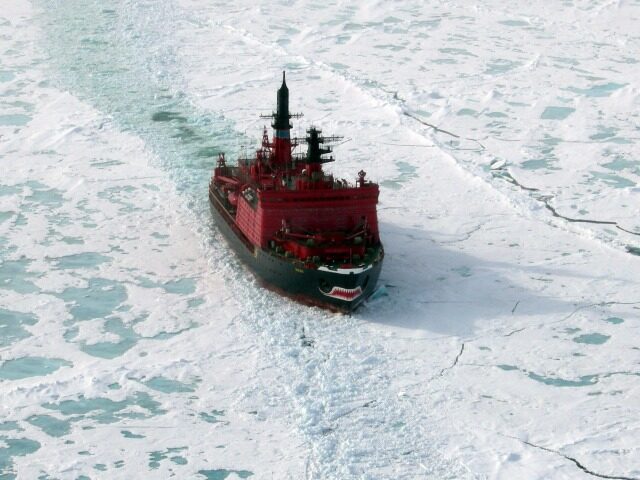 A picture taken on May 5, 2016 shows the icebreaker Tor (R) at the port of Sabetta in the