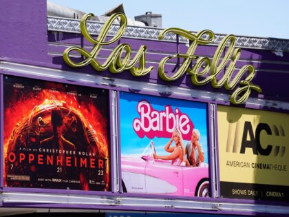 The marquee for the Los Feliz Theatre features the films "Oppenheimer" and "Barbie," Frida