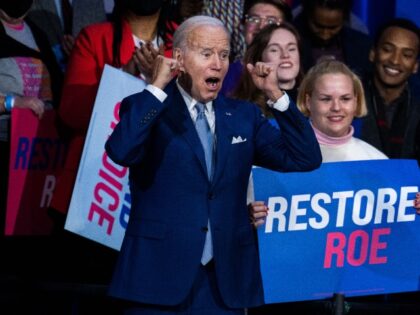 UNITED STATES - OCTOBER 18: President Joe Biden addresses the crowd after speaking about the importance of electing Democrats who want to restore abortion rights, during an event hosted by the Democratic National Committee at the Howard Theatre in Washington, D.C., on Tuesday, October 18, 2022. (Tom Williams/CQ-Roll Call, Inc …