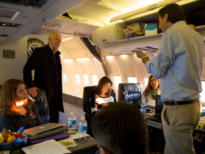 VP Joe Biden being briefed by Amos Hochstein, then-Special Envoy aboard Air Force 2 on the