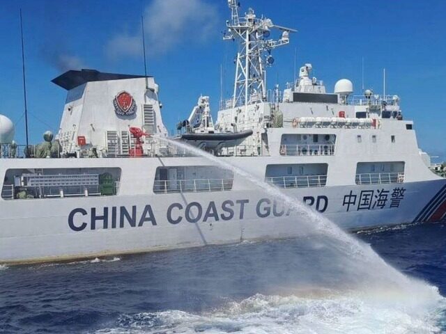 In this handout photo provided by the Philippine Coast Guard, a Chinese coast guard ship uses water canons on a Philippine Coast Guard ship near the Philippine-occupied Second Thomas Shoal, South China Sea as they blocked it's path during a re-supply mission on Saturday Aug. 5, 2023. The Philippine military …